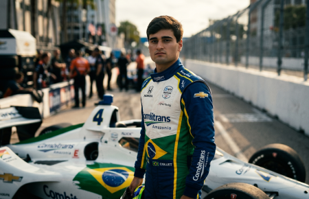 Caio Collet in AJ Foyt Racing IndyCar suit standing next to number 4 Chevrolet with Combitrans Amazonia sponsorship representing Brazil
