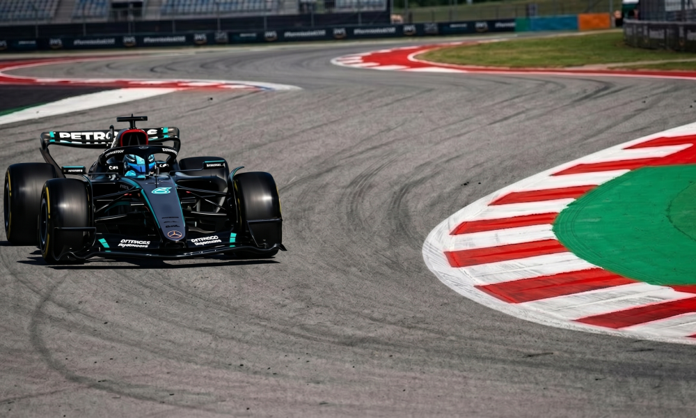 Mercedes F1 car cornering at Barcelona Circuit during practice session, 2026 Spanish Grand Prix