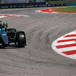 Mercedes F1 car cornering at Barcelona Circuit during practice session, 2026 Spanish Grand Prix