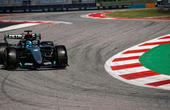 Mercedes F1 car cornering at Barcelona Circuit during practice session, 2026 Spanish Grand Prix